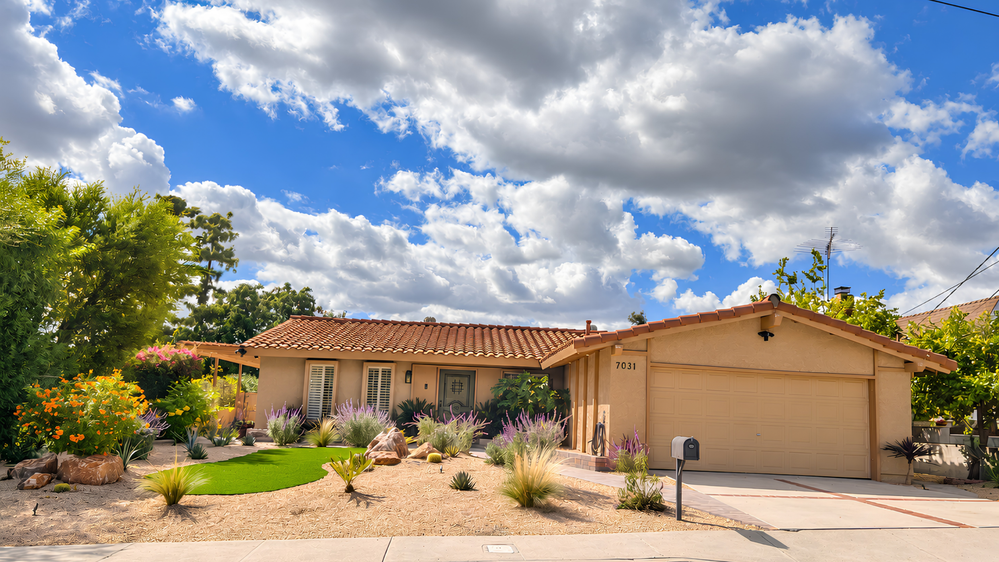 Front exterior of 7031 Rivol Road in West Hills, with tile roof, attached garage and desert landscaping